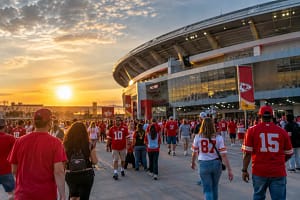 Kansas City stadiums near active construction and public streets at dusk
