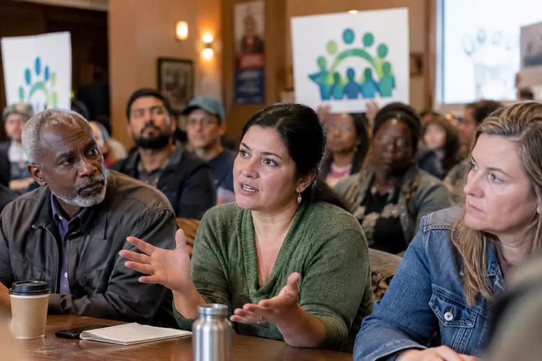 Community Stadium Financing meeting with fans and officials reviewing venue plans